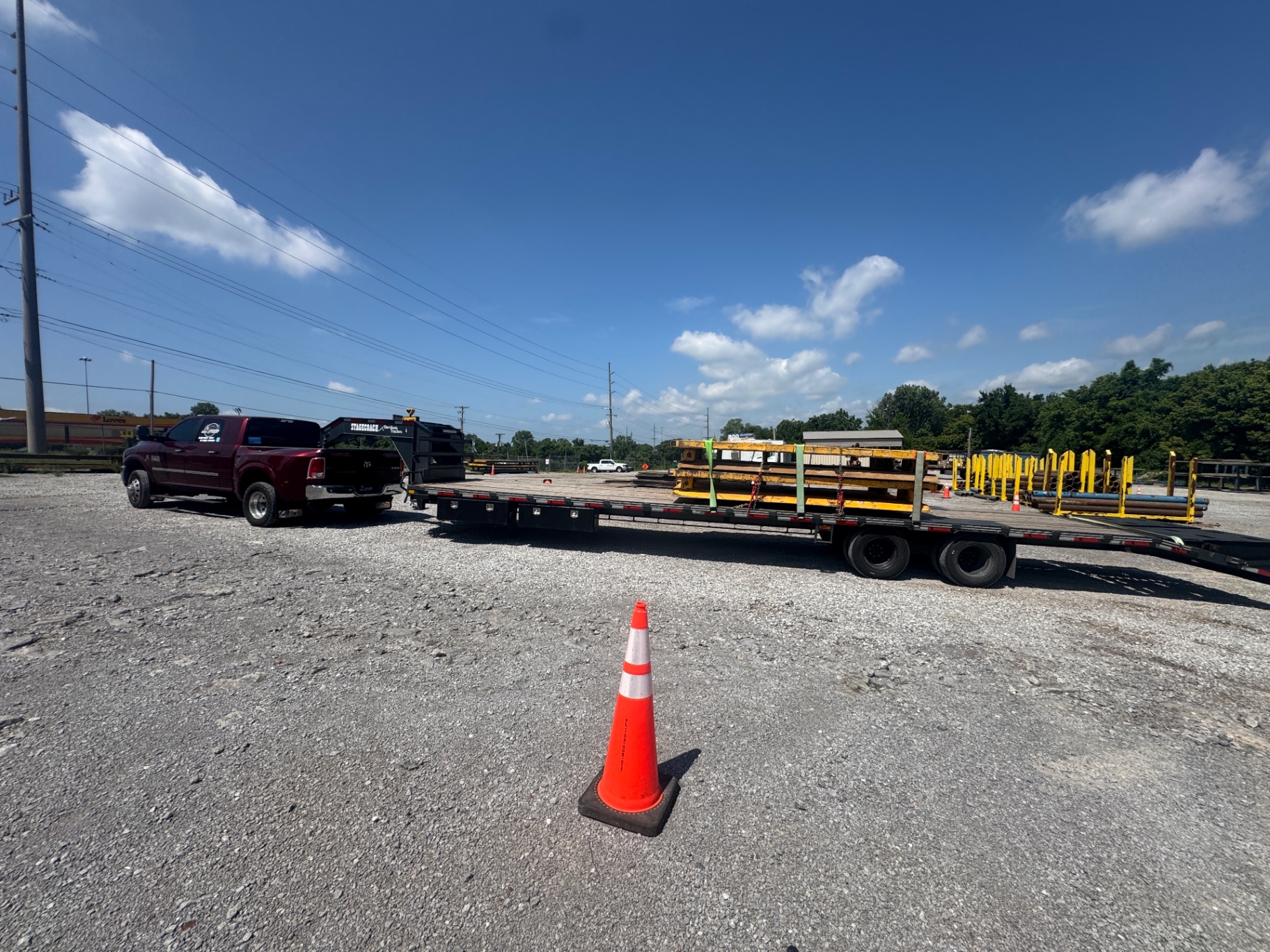 Heavy machinery transport on open highway, clear sky