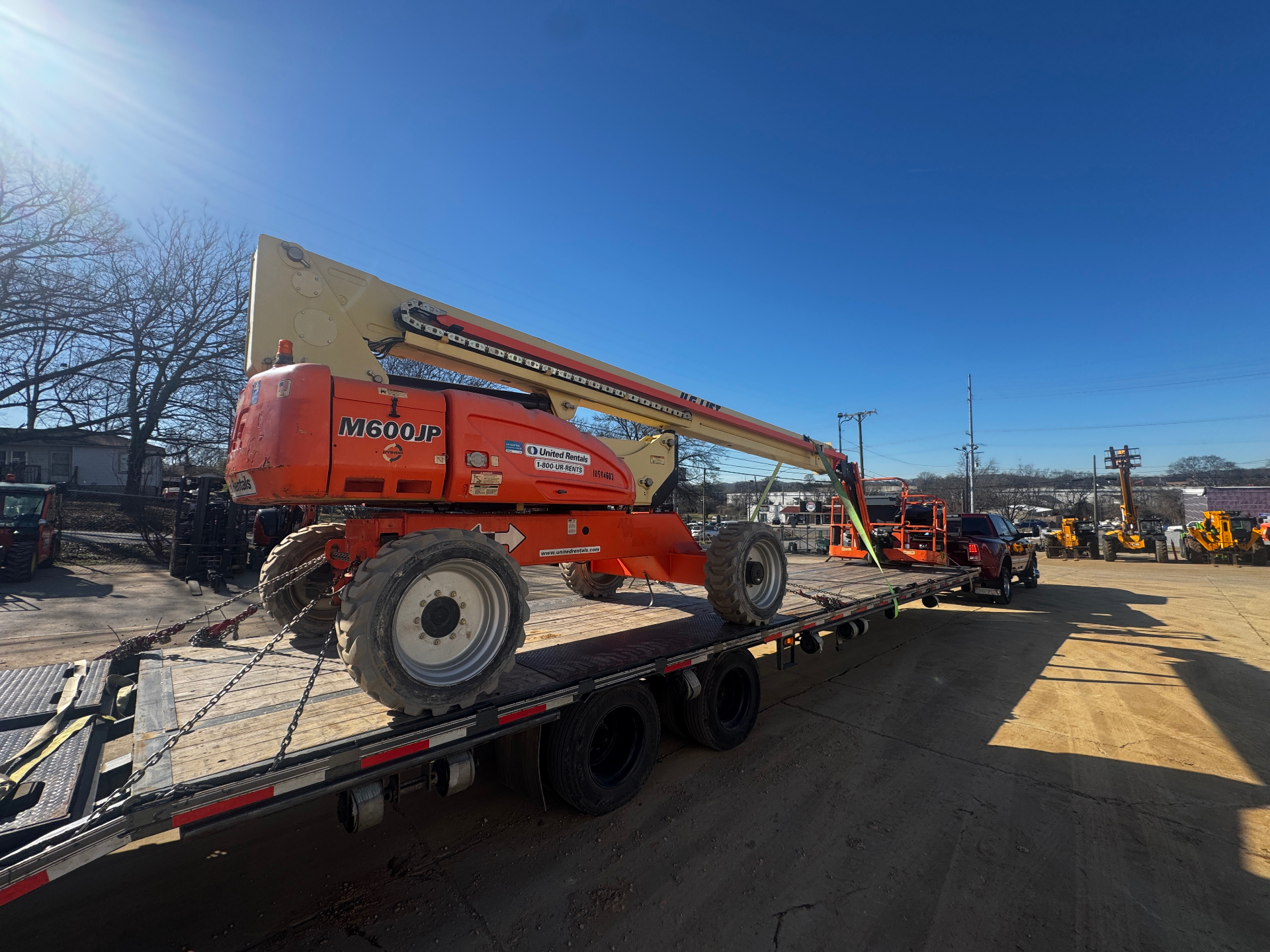Agricultural equipment on flatbed trailer ready for transport