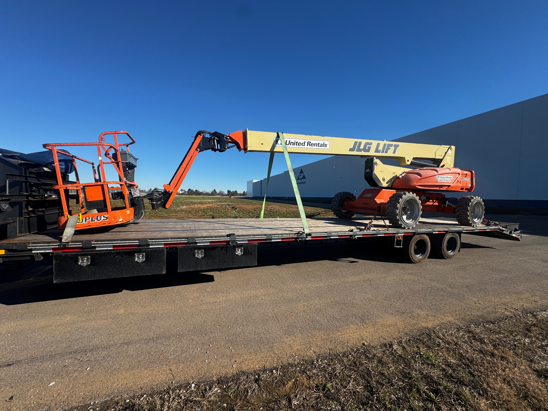 Heavy load secured on trailer with professional rigging equipment
