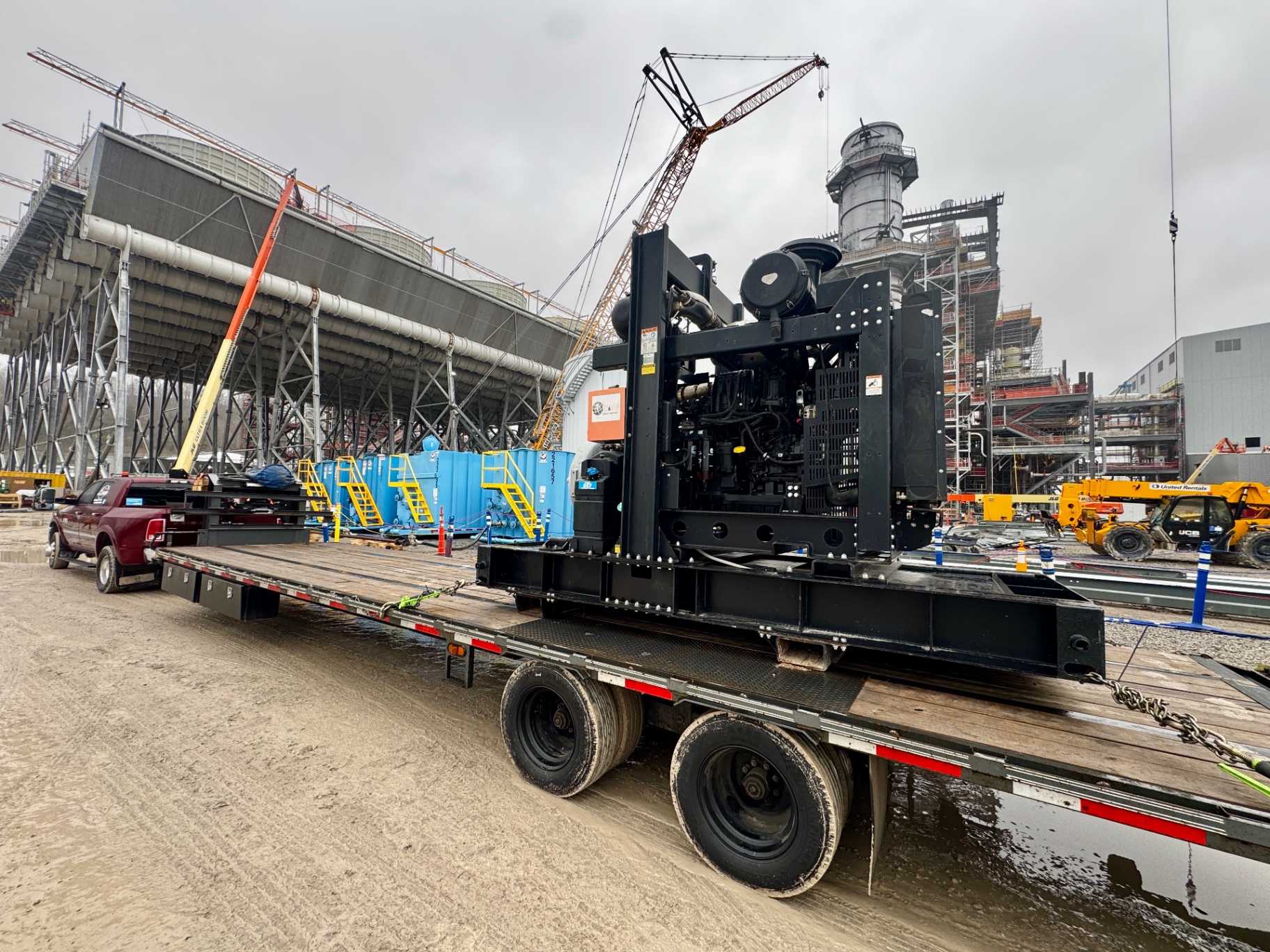 Heavy equipment unloading at farm using mega ramps