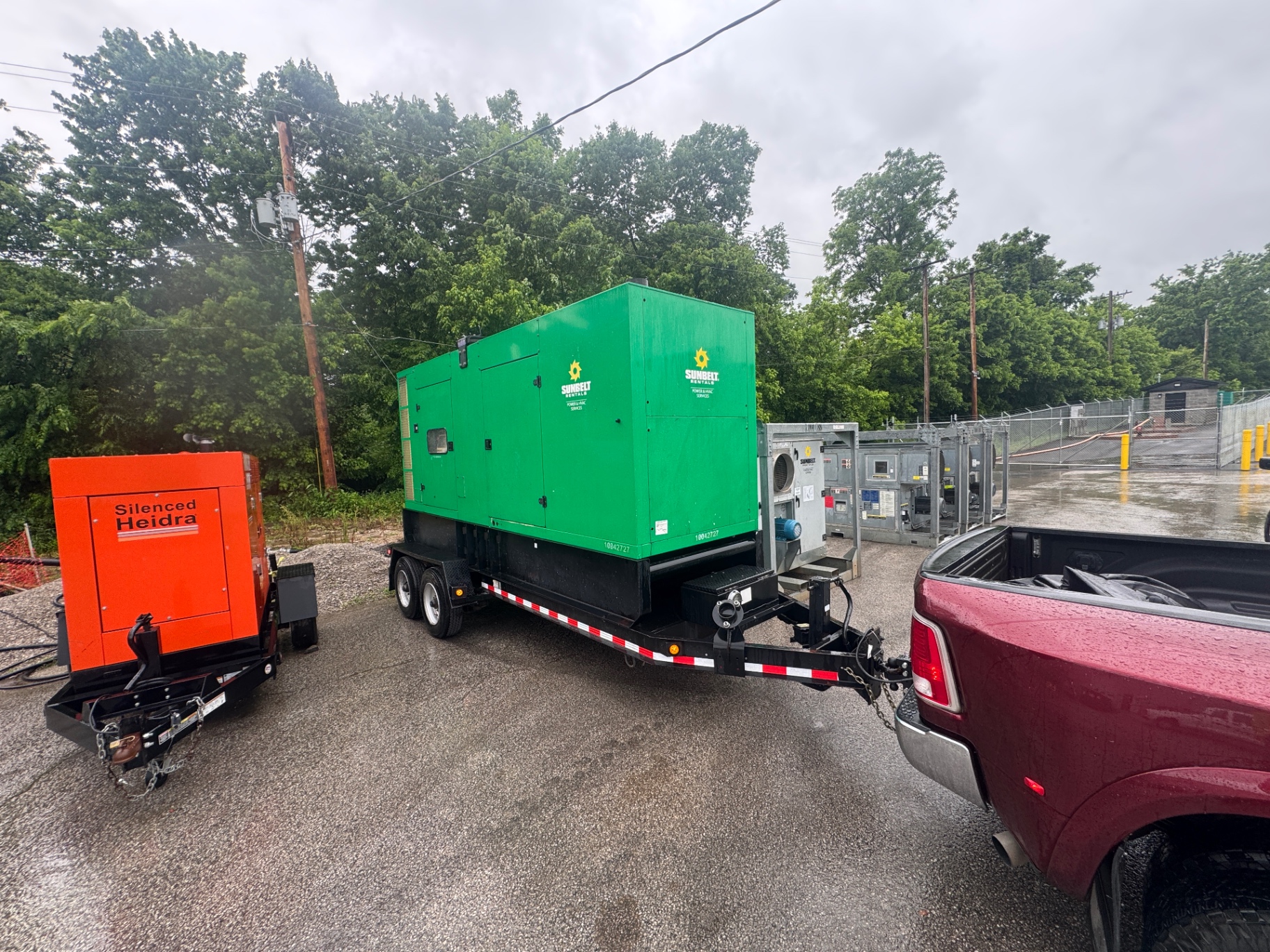 Flatbed truck parked at delivery site, industrial background